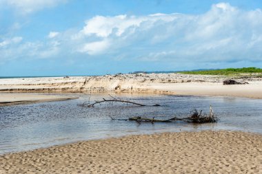 River sand landscape against blue sky in the background. Guaibim beach in the city of Valenca, Bahia, Brazil.