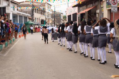 Saubara, Bahia, Brazil - August 06, 2022: Members of Cheganca de Mouros Barra Nova Feminina parading in line at the Chegancas cultural meeting in Saubara, Bahia.