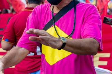 Salvador, Bahia, Brazil - April 09, 2022: People protesting against far-right presidential candidate Jair Bolsonaro, with posters flags and banners representing him as a Nazi