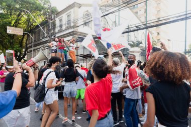 Salvador, Bahia, Brazil - April 09, 2022: People protesting against far-right presidential candidate Jair Bolsonaro, with posters flags and banners representing him as a Nazi
