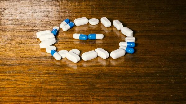 Simple Pile White Blue Pills Medicines Pills Stacked Brown Background — Stock Fotó