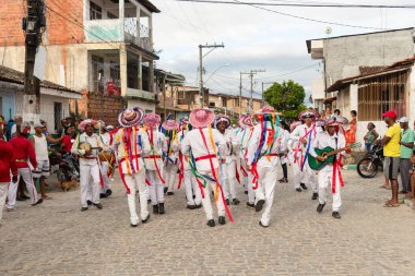 Saubara, Bahia, Brazil - August 06, 2022: Members of the Marujada de Curaca dance and sing at the Chegancas cultural meeting in Saubara, Bahia.