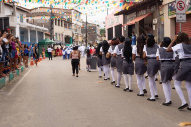 Saubara, Bahia, Brazil - August 06, 2022: Members of Cheganca de Mouros Barra Nova Feminina parading in line at the Chegancas cultural meeting in Saubara, Bahia.
