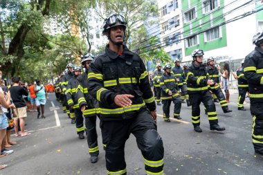 Salvador, Bahia, Brazil - September 07, 2022: Soldiers of the Bahia Fire Department parading on Brazilian Independence Day through the streets of downtown Salvador, Brazil.