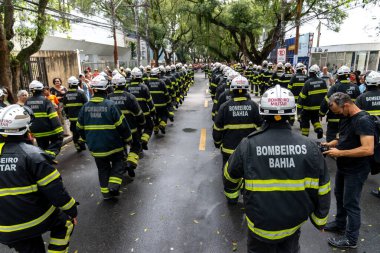 Salvador, Bahia, Brazil - September 07, 2022: Soldiers of the Bahia Fire Department parading on Brazilian Independence Day through the streets of downtown Salvador, Brazil.