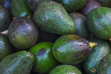 delicious avocados for sale in baskets