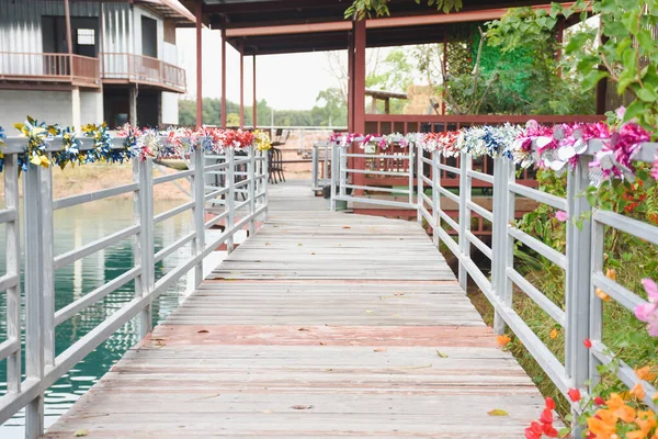 The wooden bridge over the water is ready to use.