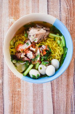Clear soup noodles with pork and vegetables and fish balls and red pork