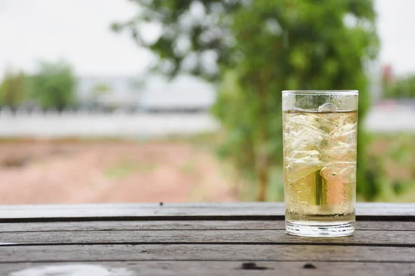 Clear Glass Ice Wooden Table Stock Photo