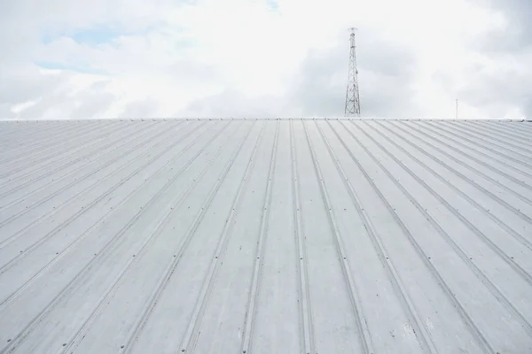 metal sheet roofing on commercial construction with blue sky