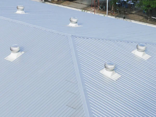 Beautiful gray metal sheet roof in commercial construction.