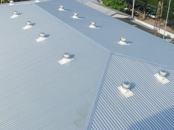 Beautiful gray metal sheet roof in commercial construction.