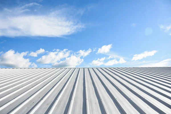 metal sheet roofing on commercial construction with blue sky