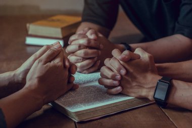 Christian Bible Study Concepts. Group of Christian read and study the bible together in a home. followers are studying the word of God and worship in church