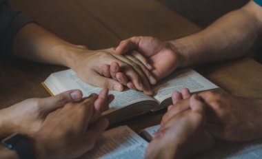 Christian Bible Study Concepts. Group of Christian read and study the bible together in a home. followers are studying the word of God and worship in church