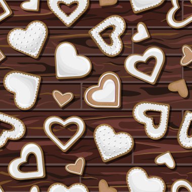 Tahta masanın arka planında izole edilmiş kalp şeklinde kusursuz beyaz kurabiyeler..