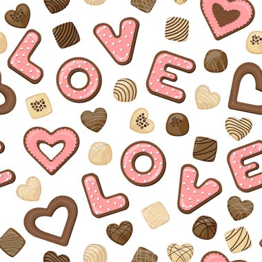 Mercan cilası ve beyaz üzerine izole edilmiş sütlü çikolatalarla sevilen harf şeklinde kusursuz kurabiyeler..