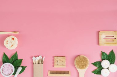 Directly above view of spa products on pink background, Healthcare spa concept with copy space