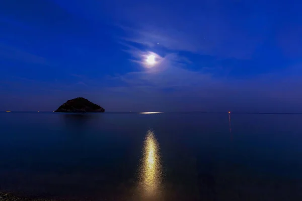 Full Moon Reflecting Blue Water Sea Forming Beautiful Ray Yellow Stock Photo