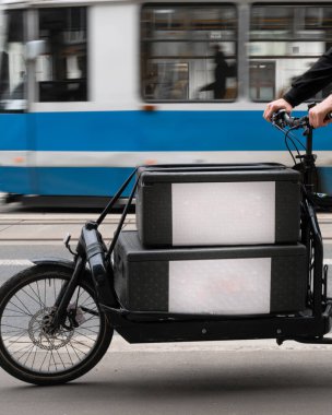 black cargo courier bike with two boxes close-up and space for logo