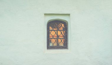 Background of castle wall. Old wall with window. Wall texture. Graphic texture element.