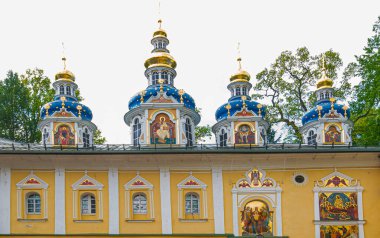 Churches of Russia. Orthodox shrine. Ancient Russian cities. View of beautiful buildings and Orthodox churches Ancient Pskov-Pechersky monastery in Pechory, Russia. Travel to Russia. Pilgrimage.