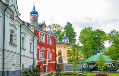 Churches of Russia. Orthodox shrine. Ancient Russian cities. View of beautiful buildings and Orthodox churches Ancient Pskov-Pechersky monastery in Pechory, Russia. Travel to Russia. Pilgrimage.