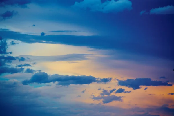 Detail of clouds by sunset sunrise with blue and gold color — Stock Photo, Image