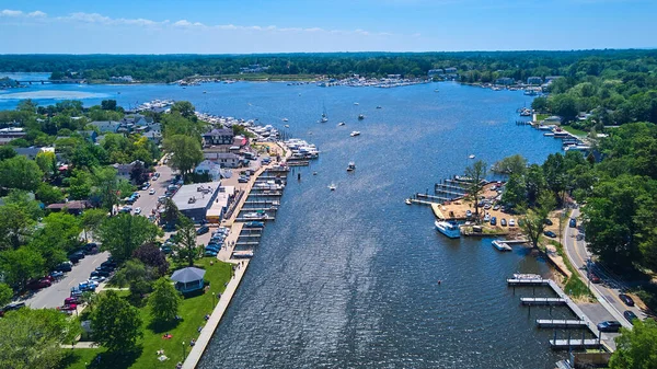 River and lake in country town with dock full of boats — Stock Photo, Image