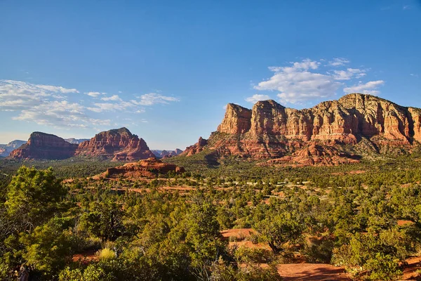 Landscape with trees in the foreground and Bell Rock in the background against a blue sky — Stock Photo, Image