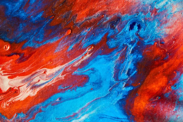 Colorful acrylic pouring on canvas with red and blue — Stock Photo, Image