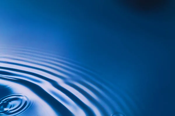 Pure blue water with ripples in corner — Stock Photo, Image