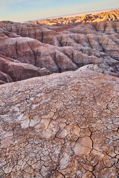 Image of Cracked desert grounds of Badlands sediment layers