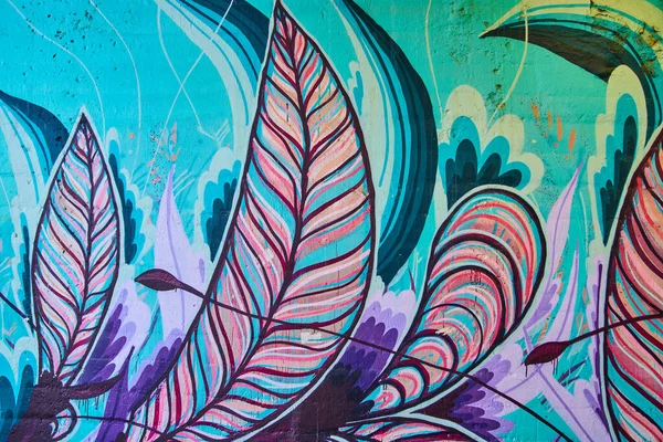 Image of Detail of cool colored feather graffiti on wall
