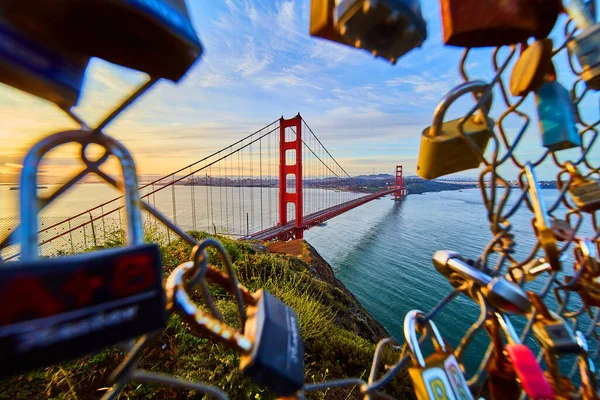 Image of Locks on fence with opening to the Golden Gate Bridge in California