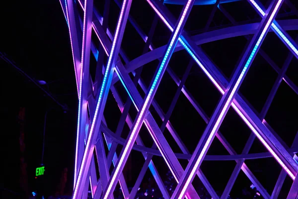Image of Blue and purple LED lights on art display funnel