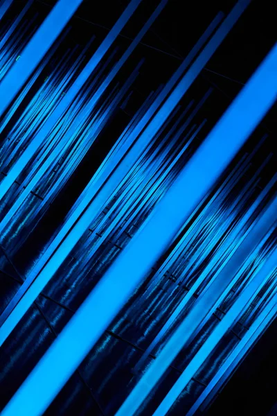 Image Abstract Neon Light Poles Angled Blue — Zdjęcie stockowe