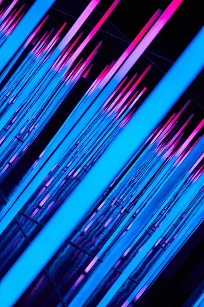 Image of Abstract neon lights of blue and pink