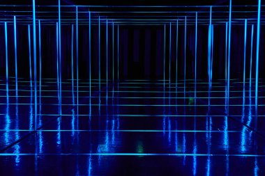 Image of Mirror walkway lined with blue neon lights