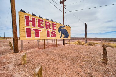 Image of Wide angle of iconic here it is billboard with jack rabbit