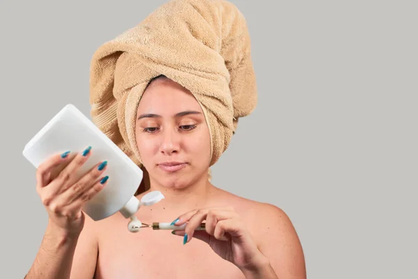 Half Naked Latin Woman Massaging Face Jade Roller — Stock Photo, Image