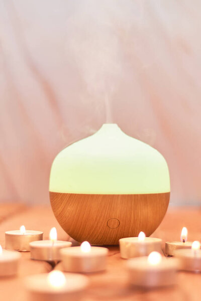 Aroma oil diffuser and candles. Aromatherapy concept