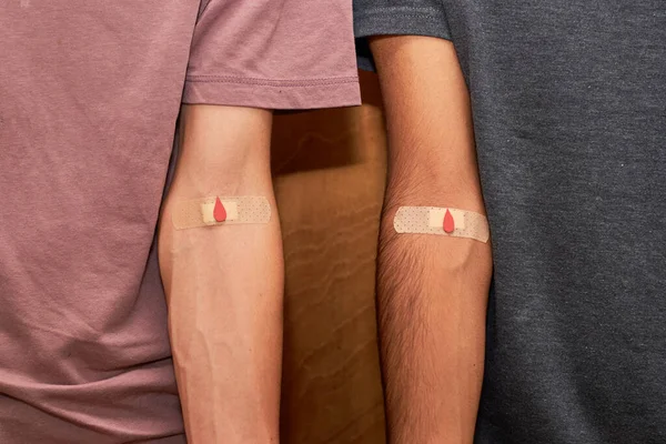 Blood Donorship Two Arms Taped Patch Giving Blood Red Drop — Foto de Stock