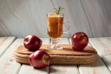Apple cider or tea in cups, hot beverage for autumn.