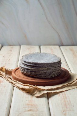 Stacked Mexican blue tortillas, made with blue corn.