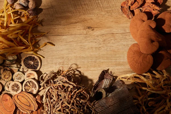 Traditional chinese medicine with herb and spices in brown wooden background and blank space for medicine advertising , photography traditional medicine content