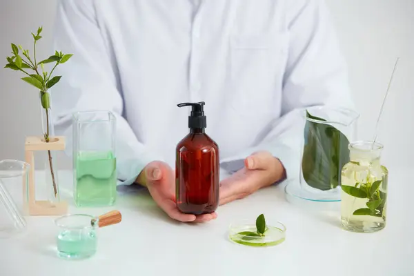 Plants and flowers extract in petri dish and a white background in laboratory , green leaf in a test tube and doctor for cosmetic advertising , photography science concept