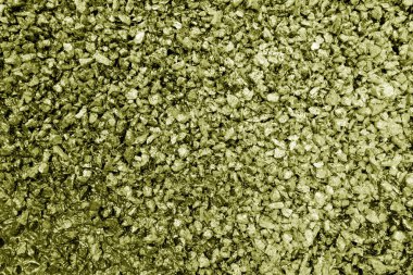 Asphalt road closeup in yellow tone. Background and texture.     