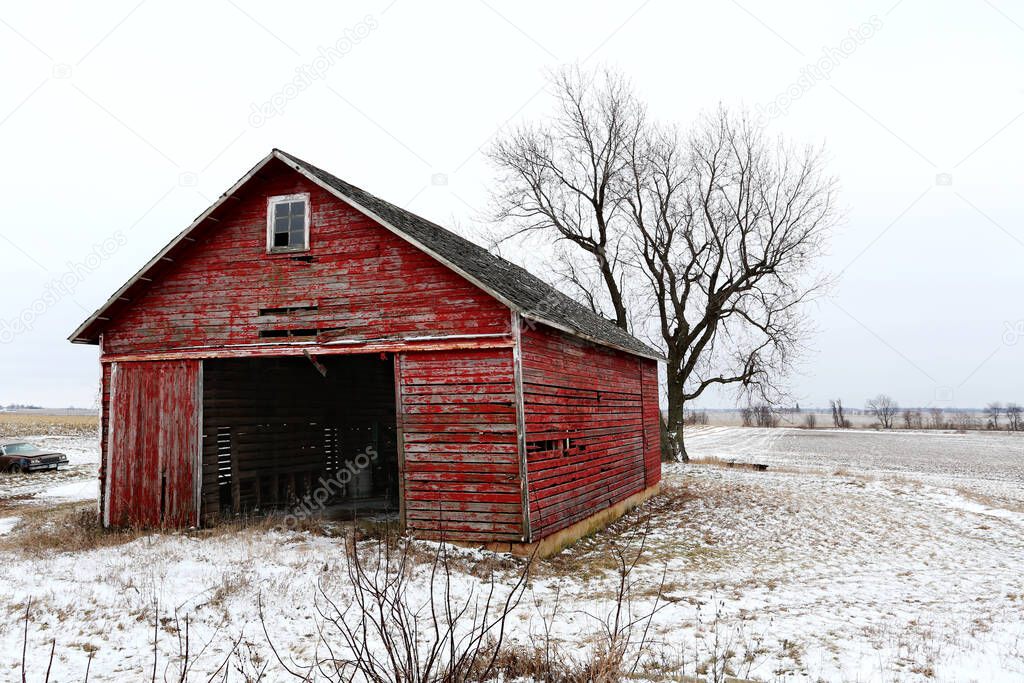 A beautiful old red barn in the snow in Illinois