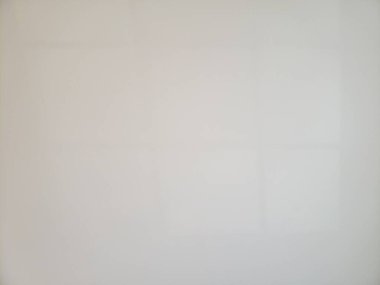 Faint Shadows of a Window on a White Wall